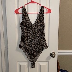 Size M cheetah print body suit